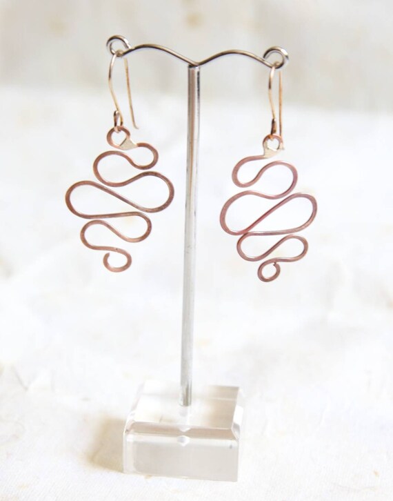Hammered copper earrings on oxidised sterling silver earwires.