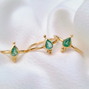 Thin gold-plated ring with emerald