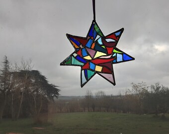 Multicolored stained glass star to hang, handmade with 7 branches of 20 cm side. Unique model, original gift at a low price.