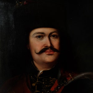 May include: A portrait painting of a man with a dark mustache and a black hat. He is wearing a dark jacket with gold accents and a red sash.