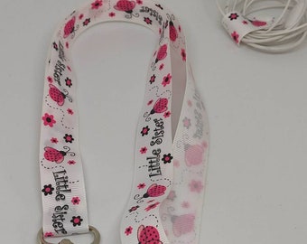 Wrist strap for white "little sister" badge and lightly glittery pink ladybug Free shipping