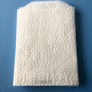 May include: White paper sheet with a dotted pattern. The sheet is 3.75 inches by 5 inches.