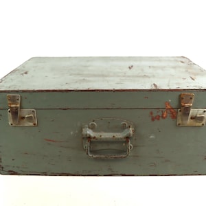 Antique wooden suitcase in turquoise