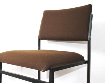 Designer loft chair with tubular steel frame