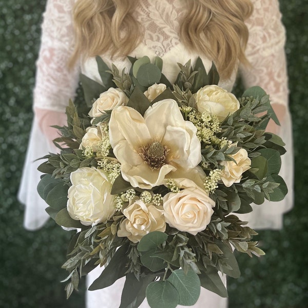 Cream bouquet with magnolia, roses, gardenias, Eucalyptus and greenery