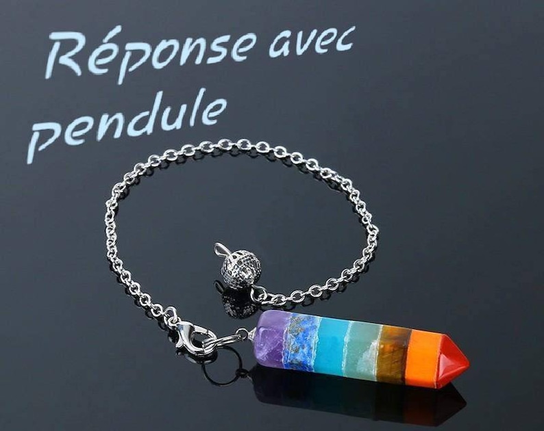 May include: A silver chain with a seven-chakra crystal pendulum. The pendulum is a pointed, multi-colored crystal with a silver loop at the top. The text "R&eacute;ponse avec pendule" is written in white on a black background.
