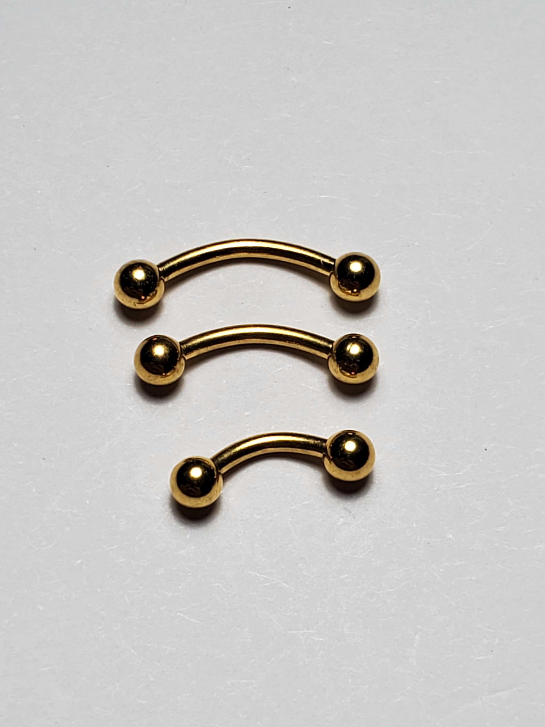 14K Yellow Gold Eyebrow Ring - Curved Barbell 3mm Ball, 16G/18G, BodyJewelryOnline