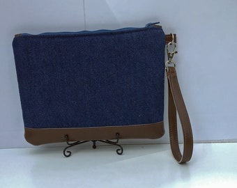 Denim wristlet with faux leather strap and accents