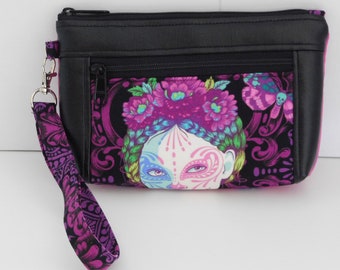 double zipper devon wristlet made with Tula Pink deLuna line.  Has faux leather accents and fully lined.