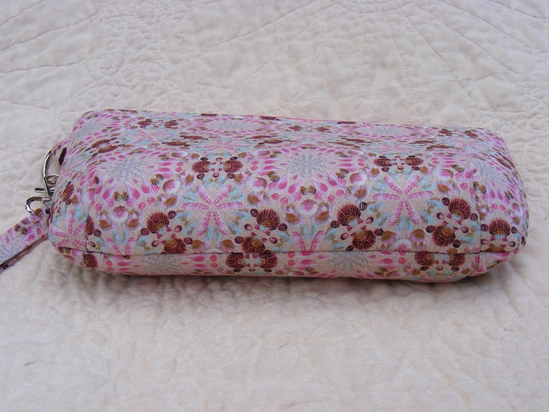 Pink and brown sea shell print wristlet