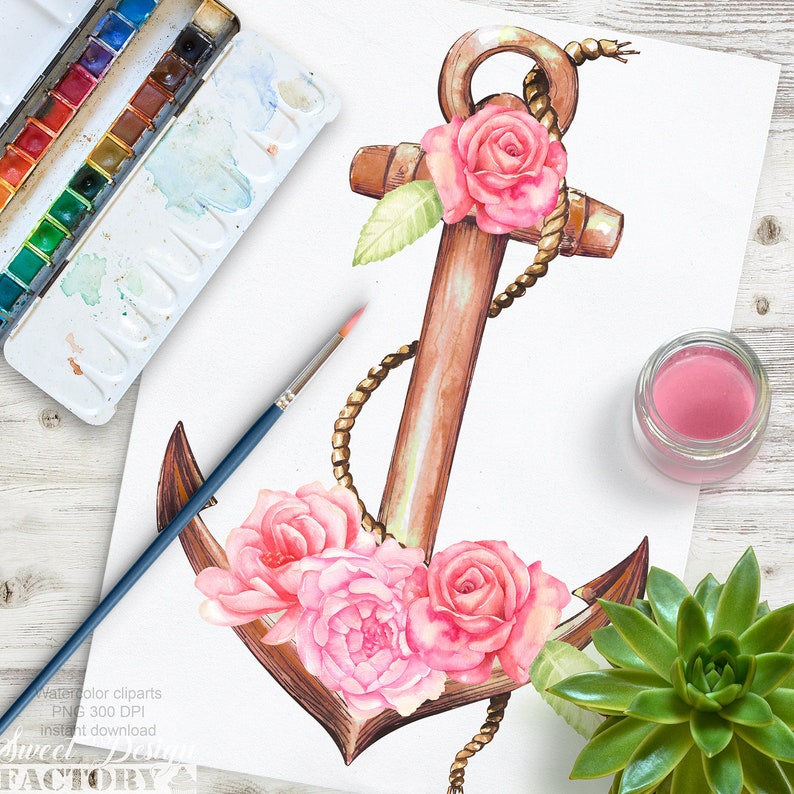 Peut inclure: Une illustration aquarelle d'une ancre brune avec une corde dor&eacute;e enroul&eacute;e autour. L'ancre est d&eacute;cor&eacute;e de roses roses et de feuilles vertes.