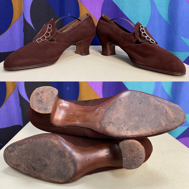 May include: Pair of vintage brown suede shoes with a decorative scalloped design on the vamp. The shoes have a small heel and a strap. The soles show signs of wear, indicating their age.