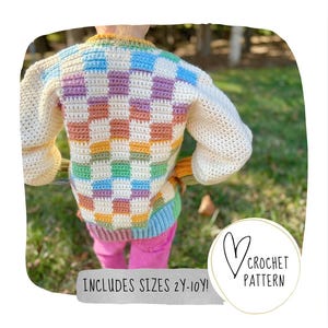 May include: A rainbow checkered crochet sweater with long sleeves and a white background. The sweater is shown on a child in a pink shirt and blue jeans. The text "INCLUDES SIZES 2Y-10Y!" is at the bottom of the image. The text "CROCHET PATTERN" is in a heart shape at the bottom right of the image.