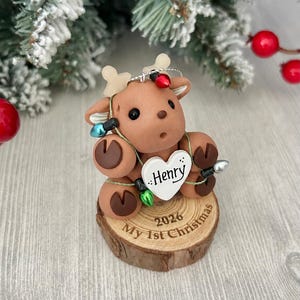 Reindeer Baby First Christmas ornament personalized. Baby boy, Baby girl, Reindeer tangled in Christmas lights, Handcrafted baby gift