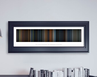 May include: A framed black and white print of a color bar graphic representing the movie "The Lord of the Rings: The Fellowship of the Ring".