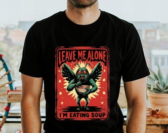 Mothman Eating Soup T-Shirt: Funny Cryptid Graphic Tee