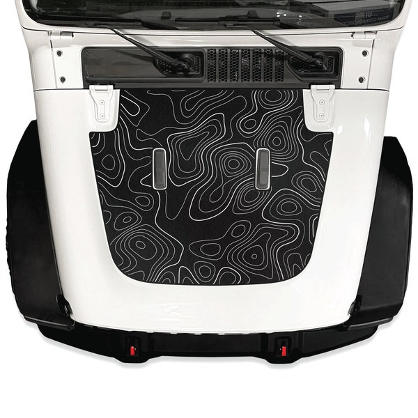May include: A white Jeep Wrangler with a black hood wrap featuring a topographic map design. The hood wrap has a white outline of the map.