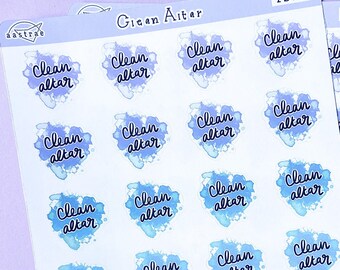 Könnte beinhalten: Zwei Blätter mit Aufklebern mit Aquarelldesign. Jeder Aufkleber zeigt einen blauen und violetten Aquarellspritzer mit dem Text "Clean Altar" in schwarzer Kursivschrift.