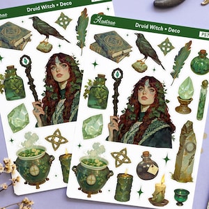 May include: Two sticker sheets with a Druid Witch theme, featuring illustrations of a woman, potion bottles, a raven, and a cauldron. Tarot cards, crystals, and a candle are also present. The stickers have the text "Druid Witch + Deco" and "Astrase".