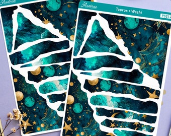 May include: Two sheets of teal and gold patterned washi tape with a torn edge design. The washi tape features a celestial theme with stars, moons, and planets. The sheets are labeled "Taurus + Washi" and "PS212".