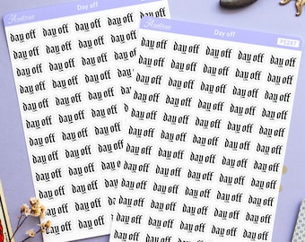 May include: Two sheets of stickers with the text "Day off" repeated in a gothic font on a light purple background. The stickers are surrounded by tarot cards, a candle, a moon and sun figurine, and small white flowers.