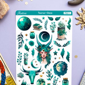 May include: A sheet of stickers featuring a green and gold Taurus zodiac sign with a crescent moon, stars, and plants. The stickers are labelled "Taurus Deco" and "PS211".