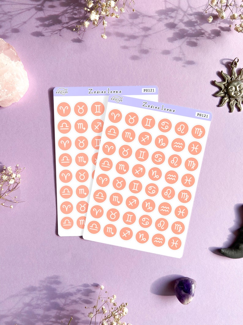 May include: Two sheets of stickers with peach-colored circles featuring the astrological signs. Each sheet has the text "Zodiac Icons" and "PS121" printed on it.