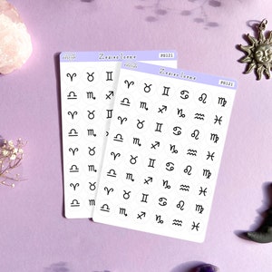 May include: Two sheets of white sticker paper with black zodiac symbols printed on them. The stickers are in a circle shape and are arranged in rows. The text "Zodiac Icons" is printed on the top of each sheet.