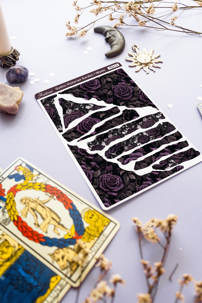 May include: A sheet of decorative washi tape with a gothic Victorian garden design. The tape features a dark background with purple roses and vines. The text "Gothic Victorian Garden - Washi" is printed on the tape.