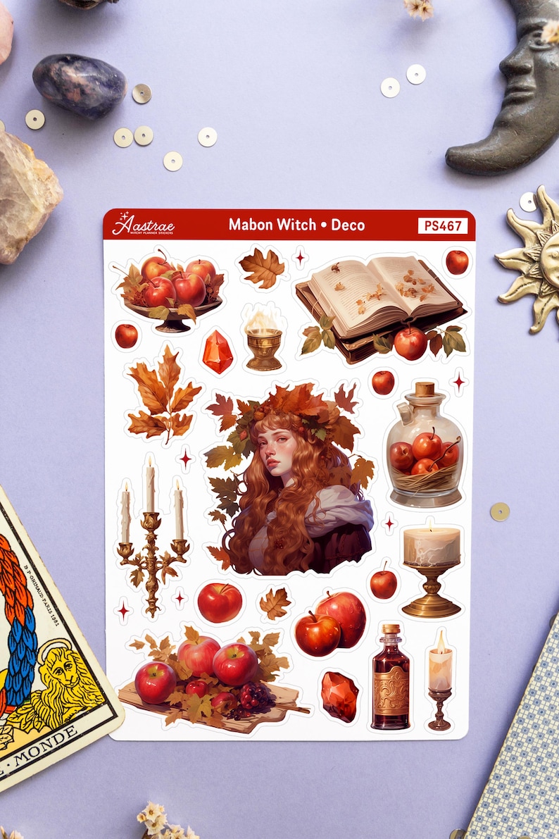 May include: A set of 16 stickers featuring a witch, apples, candles, a book, a bottle, and other autumnal elements. The stickers are white with a red border and the text "Mabon Witch &bull; Deco" and "PS467".