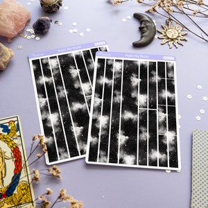 May include: Two sheets of black and white night sky washi tape with a starry sky design. The washi tape is labeled "Night Sky Washi" and "WS018".