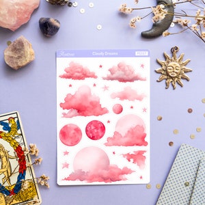 May include: A sheet of pink and white stickers with a watercolor design of clouds, stars, and moons. The sheet is labeled "Cloudy Dreams" and "PS327".