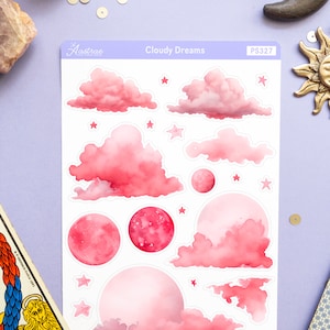 May include: A sheet of pink and white stickers featuring clouds, moons, and stars. The stickers are labeled "Cloudy Dreams" and "PS327".