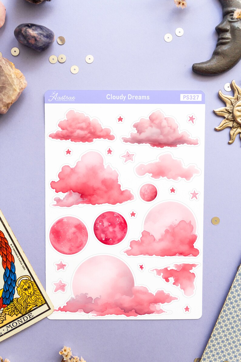 May include: A sheet of pink and white stickers featuring clouds, moons, and stars. The stickers are labeled "Cloudy Dreams" and "PS327".