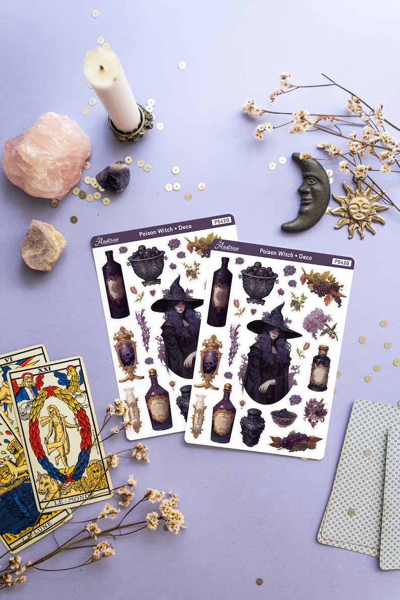 May include: Two sheets of stickers featuring a witch with purple hair and a black dress, holding a skull. The stickers also include bottles, flowers, and other witchy elements. The stickers are labeled "Poison Witch Deco" and "Aastrae" with the product number "PS420".