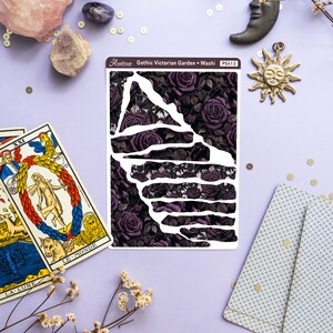 May include: A sheet of decorative washi tape with a gothic Victorian garden design. The tape features a dark purple background with black outlines of roses and leaves. The text "Gothic Victorian Garden - Washi" and "PS413" is printed on the sheet.