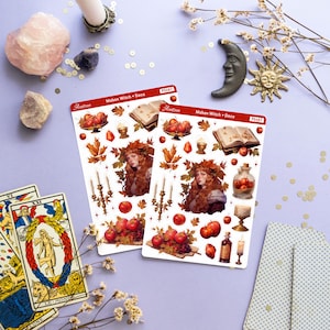 May include: Two sheets of stickers featuring a witch with red hair and a crown of leaves, surrounded by autumnal elements like apples, candles, and a book. The stickers are labeled "Mabon Witch + Deco" and "Astr&eacute;e" with the product number "PS467".