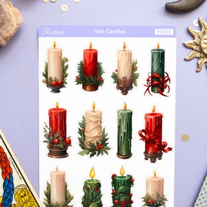 May include: A sheet of 12 Yule candle stickers. The stickers feature various candles in red, green, and white with holly and ribbon accents. The stickers are labeled "Yule Candles" and "PS315".