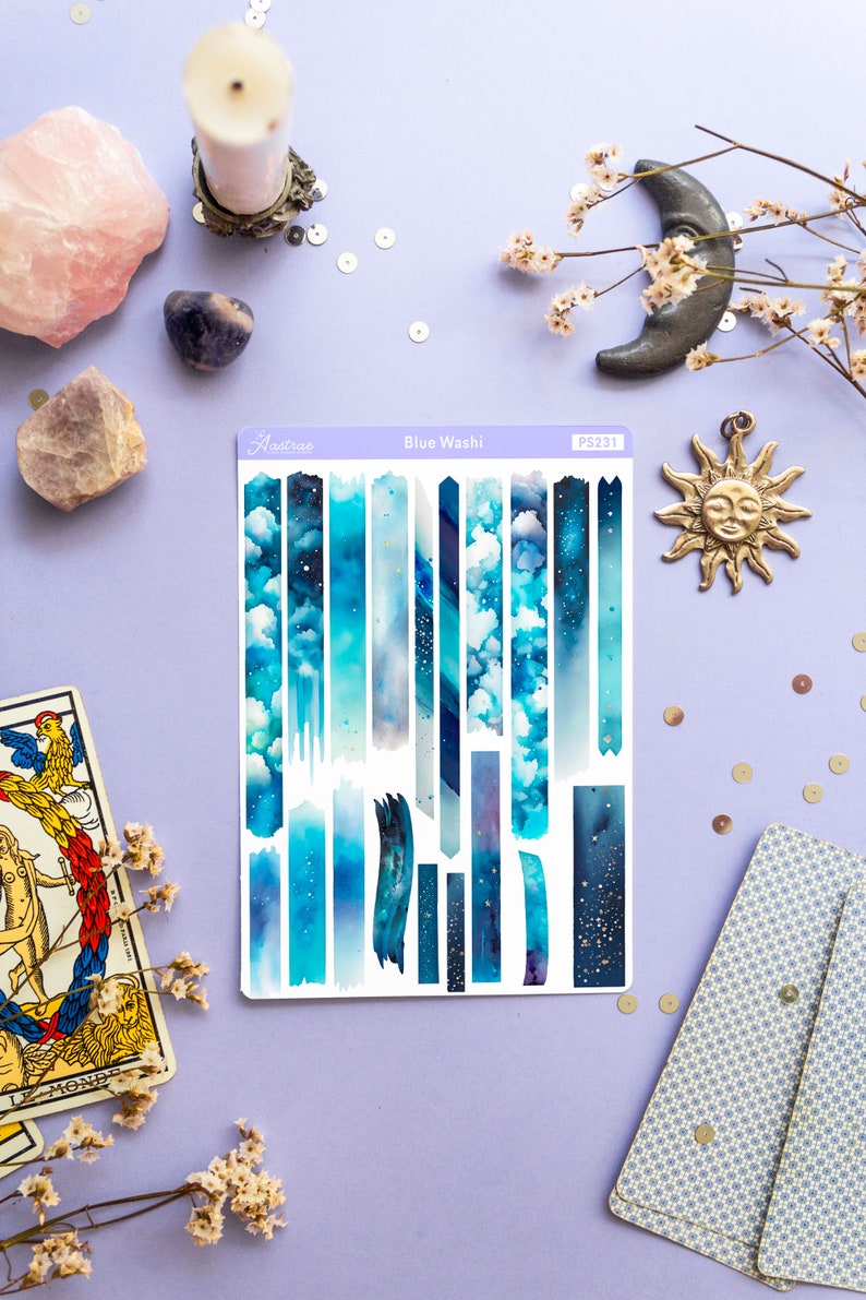 May include: A sheet of blue and white washi tape with a starry night sky and cloud design. The sheet is labeled "Blue Washi" and "PS231".
