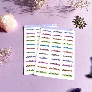 May include: Three sheets of stickers with the word "meditation" written in different colors and fonts. The stickers are on a purple background.
