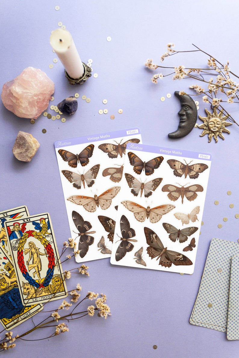 May include: Two sheets of vintage moth stickers with a white background. The stickers feature illustrations of moths in various shades of brown. The sheets are labeled "Vintage Moths" and have the product number "PS481".