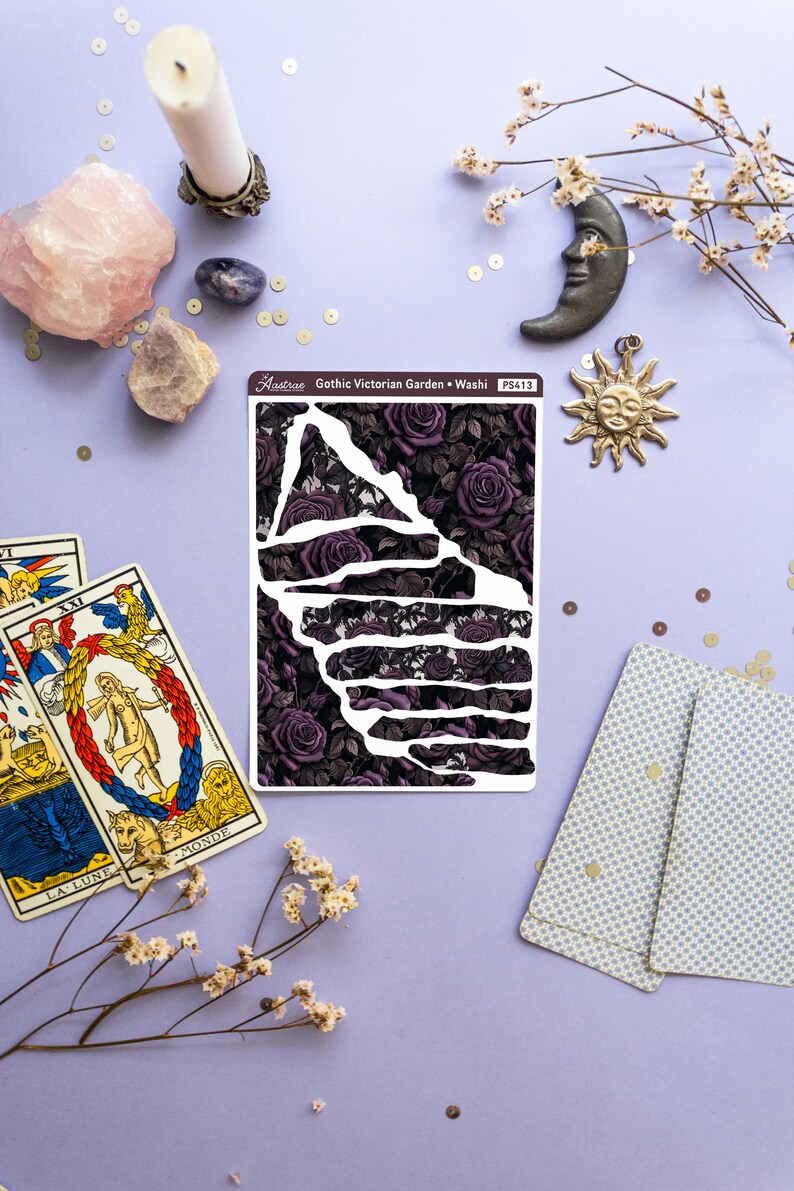 May include: A sheet of washi tape with a black and purple floral design. The tape features a repeating pattern of dark purple roses and leaves. The text "Gothic Victorian Garden - Washi" and "PS413" is printed on the sheet.