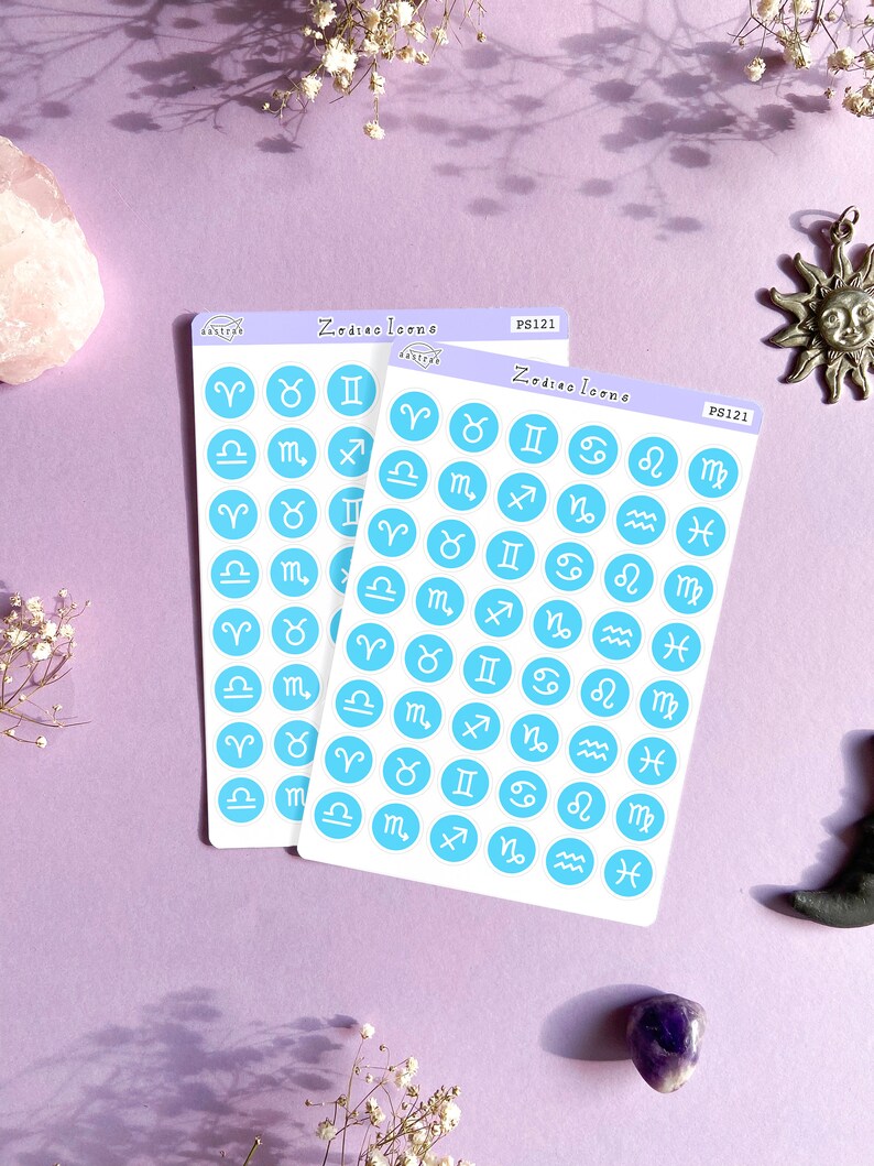 May include: Two sheets of stickers with blue circles featuring white zodiac signs. The sheets are labeled "Zodiac Icons" and "PS121".