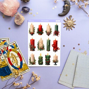 May include: A sheet of stickers featuring 12 illustrated Yule candles in red, green, and white. The candles are decorated with holly, berries, and ribbons. The stickers are labeled "Yule Candles" and "PS3115".