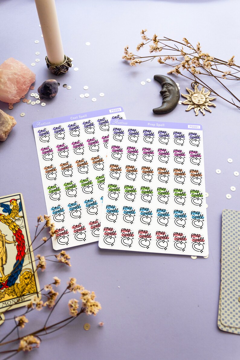 May include: Two sheets of stickers with a white background and colorful designs. The stickers are arranged in rows and columns. Each sticker features a crescent moon with a star and the words "Cast Spell" or "Prep Spell" in different colors. The stickers are labeled "PS080" and "PS081".