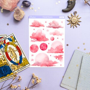 May include: A sheet of pink and white watercolor stickers with clouds, stars, and moons. The stickers are labeled "Cloudy Dreams" and "PS327".