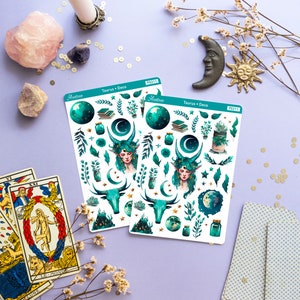 May include: Two sheets of stickers featuring a green and gold design with a celestial theme. The stickers include a woman with green hair and horns, a bull, a crescent moon, stars, and a jar. The text on the stickers reads "Taurus + Deco" and "Astroee" with the number "PS211".