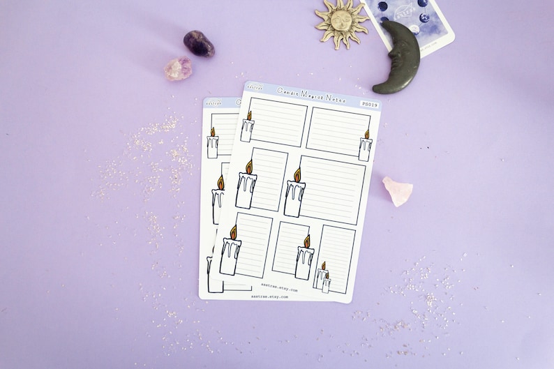 May include: Two sheets of white planner stickers with a candle and flame design. The stickers have lined sections for writing notes. The text "Candle Magic Notes" is printed on the top of the sticker sheet.