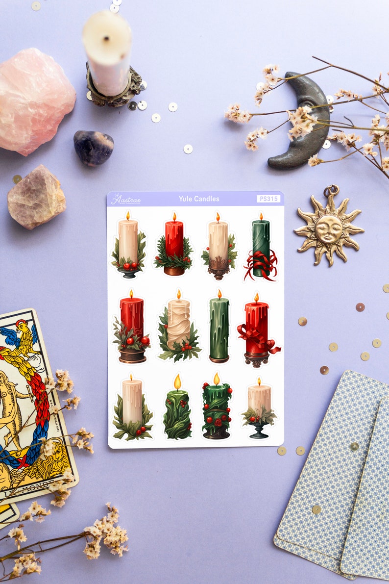 May include: A sheet of stickers featuring twelve illustrated Yule candles in various colors and designs. The candles are decorated with holly, ribbons, and other festive details. The sheet is labeled "Yule Candles" and "PS315".
