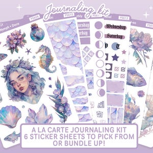 May include: A journaling kit with six sticker sheets featuring a mermaid theme. The stickers include illustrations of a mermaid, fish, seahorse, crystals, and other aquatic elements in shades of purple and blue. Text on the stickers includes "Wednesday" and "Saturday".